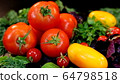 Drops of dew on red tomatoes. Red Tomatoes and Green Herbs 64798518
