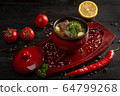 vegetable stew with potatoes and meat in a pot on a dark wooden background 64799268