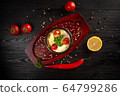 mashed potatoes in a pot decorated with tomatoes and parsley 64799286
