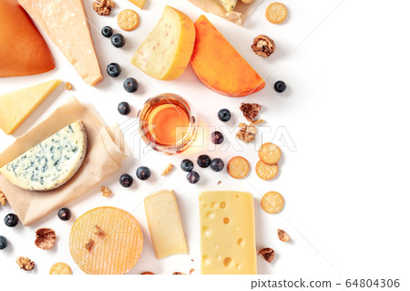 Cheese and wine tasting and pairing flat lay on a white background with a place for text. Many different cheeses, shot from above Cheese and wine tasting and pairing flat lay on a white background with a place for text. Many different cheeses, shot from above 64804306