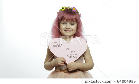 Child girl princess holds pink paper heart with text about mother. Mother's day 64804989