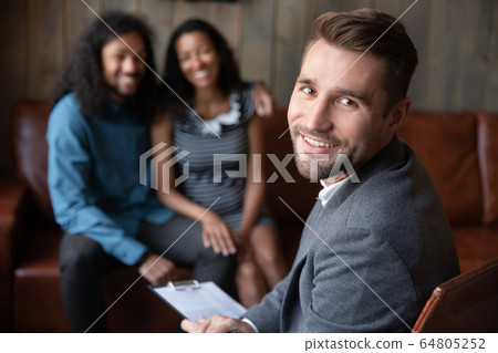 Portrait of confident male psychologist lead session with couple 64805252