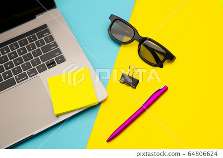 Home workplace with yellow sticky note, place for text. Pandemic Covid-19 Coronavirus quarantine concept Home workplace with yellow sticky note, place for text. Pandemic Covid-19 Coronavirus quarantine concept 64806624