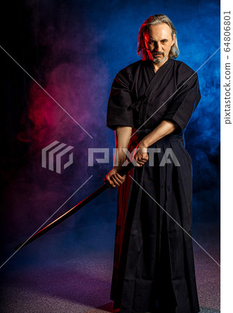 confident kendo warrior in traditional outfit 64806801