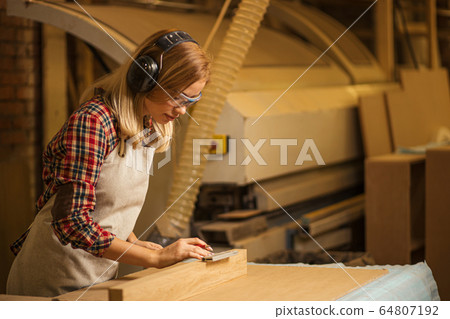 professional woodworker make marks on wood 64807192