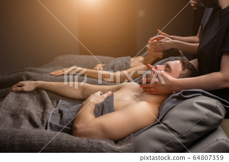 young couple at anti aging face lift procedure young couple at anti aging face lift procedure 64807359