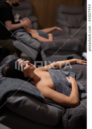 caucasian ladies have rest during face lift massage at spa caucasian ladies have rest during face lift massage at spa 64807454