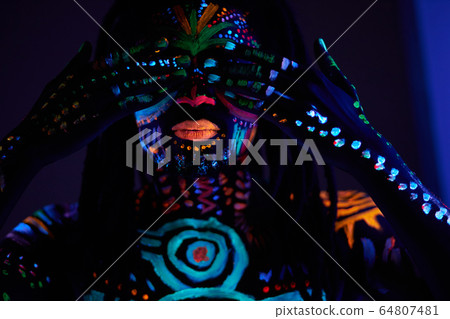 man with ethnic prints on skin closing his eyes man with ethnic prints on skin closing his eyes 64807481