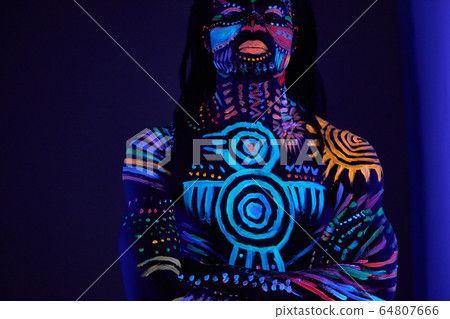 strong muscular male covered with fluorescent luminescence body art strong muscular male covered with fluorescent luminescence body art 64807666