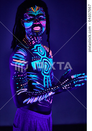 african male with fluorescent body art african male with fluorescent body art 64807667