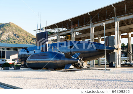 Two submarines. A small and large black submarine mounted on land in a museum in the city of Tivat, in the Porto Area of Montenegro, Montenegro Two submarines. A small and large black submarine mounted on land in a museum in the city of Tivat, in the Porto Area of Montenegro, Montenegro 64809265