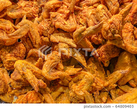 Big pile of deep-fried chicken wings for food background concept 64809403