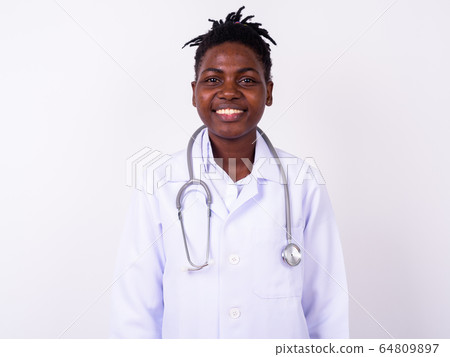 Portrait of young beautiful African woman doctor 64809897