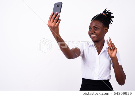Portrait of young beautiful African woman as student 64809939