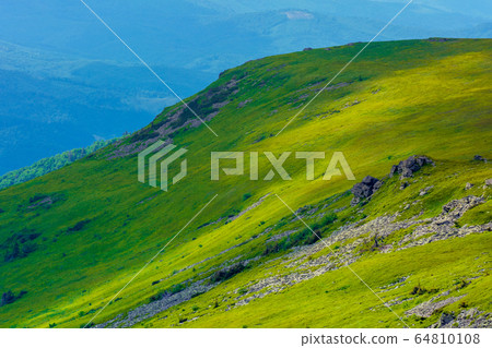 view in to the valley from the top of a mountain. 64810108