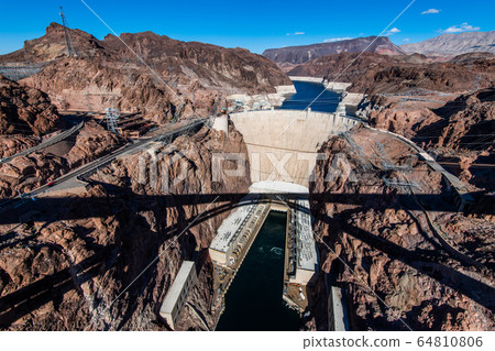 View from the Mike O'Callaghan - Pat Tillman Memorial Bridge of the famous Hoover Dam near Las Vegas, Nevada. View from the Mike O'Callaghan - Pat Tillman Memorial Bridge of the famous Hoover Dam near Las Vegas, Nevada. 64810806