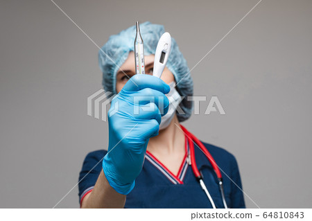 Portrait of female doctor in medical clothes with 64810843