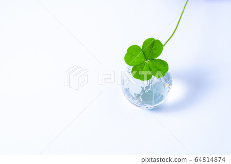 Four-leaf clover and globe clearly 64814874