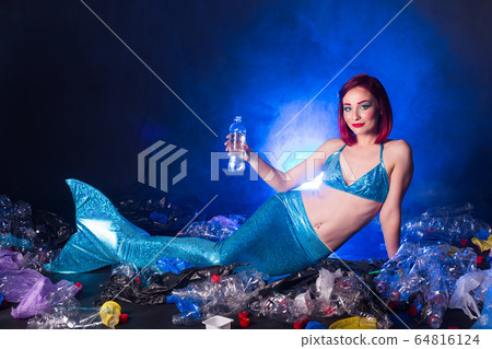 Ocean plastic pollution concept. Mermaid lives to polluted habitat. 64816124