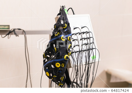 EEG or Electroencephalography hardware equipment in clinic. EEG or Electroencephalography hardware equipment in clinic. 64817424