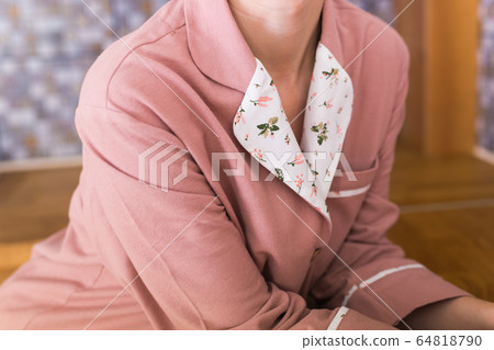 Warm kit homewear. Soft cotton shirt. Comfortable clothes for healthy sleep. Pajamas concept. Close-up. Warm kit homewear. Soft cotton shirt. Comfortable clothes for healthy sleep. Pajamas concept. Close-up. 64818790