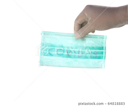 hand is showing medical face masks for covid-19 64818883