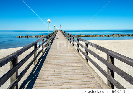 Pier on the Baltic Sea coast in Wustrow, Germany Pier on the Baltic Sea coast in Wustrow, Germany 64821964