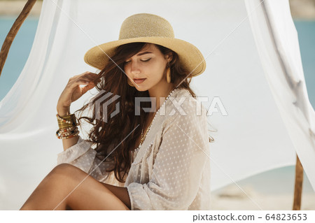 Woman Resting on the Beach During Vacation 64823653