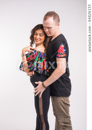 Funny couple dancing social dance. Kizomba or bachata or semba or taraxia , on white background. Social dance concept. 64826155