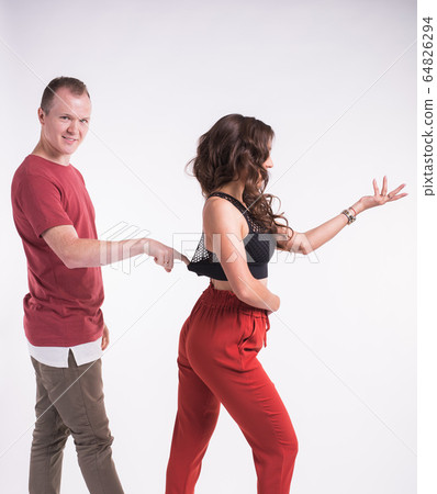 Beauty couple dancing social dance. Kizomba or bachata or semba or taraxia , on white background. Social dance concept. 64826294