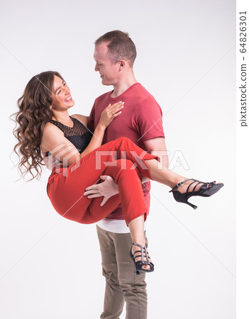 Beauty couple dancing social dance. Kizomba or bachata or semba or taraxia , on white background. Social dance concept. 64826301