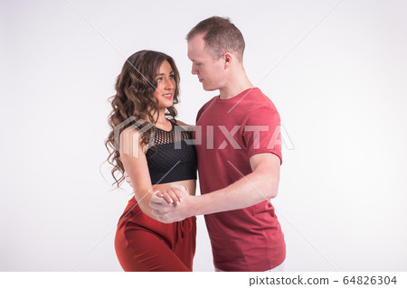 Salsa, kizomba and bachata dancers on white background. Social dance concept. 64826304