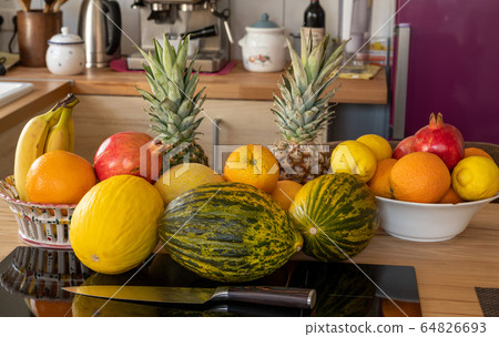 Many varieties of fresh and exotic fruits standing 64826693