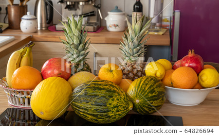 Many varieties of fresh and exotic fruits standing 64826694