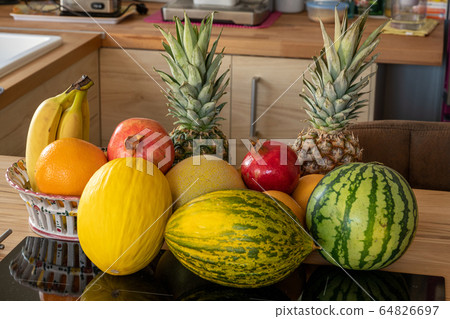Many varieties of fresh and exotic fruits standing 64826697
