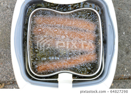 Frikadellen, a Dutch fast food snack in the oil Frikadellen, a Dutch fast food snack in the oil 64827298