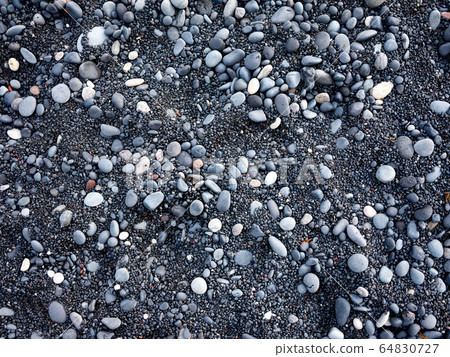 Gray pebbles as a background in the Iceland sea shore. Abstract composition. Gray pebbles as a background in the Iceland sea shore. Abstract composition. 64830727