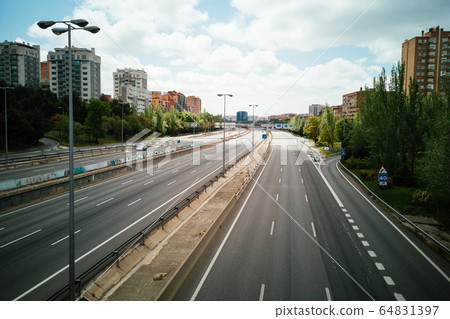 Empty M30 Highway in Madrid during COVID-19 pandemic outbreak and quarantine 64831397