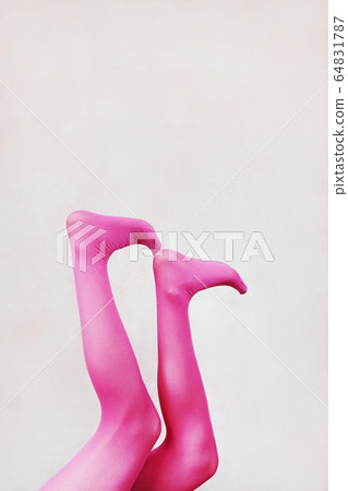Female legs wearing pink tights Female legs wearing pink tights 64831787