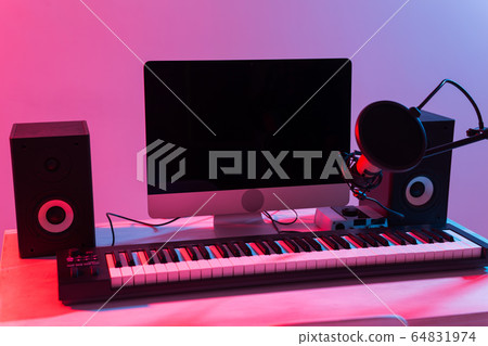 Microphone, computer and musical equipment guitars and piano background. Home recording studio concept. 64831974