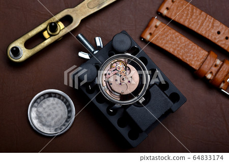 Watch repair, Vintage wrist watch overhaul and service checking mechanical movement by watchmaker. 64833174