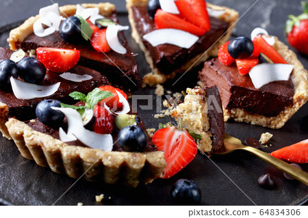 Close-up on the vegan gluten-free chocolate tart Close-up on the vegan gluten-free chocolate tart 64834306