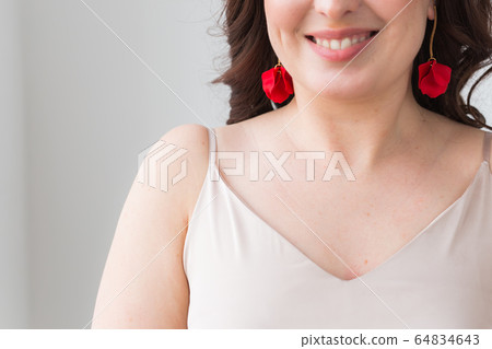 Elegant woman with earrings, close up portrait. Accessories, jewelry and bijouterie concept. 64834643