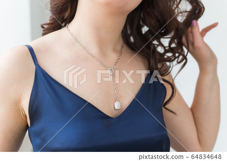 Close-up portrait of beautiful young woman with elegant luxurious jewelry and bijouterie. Close-up portrait of beautiful young woman with elegant luxurious jewelry and bijouterie. 64834648