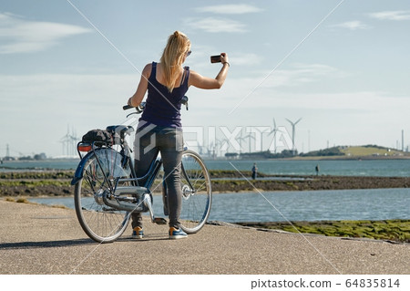 Cycling along Dutch shores 64835814