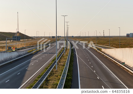 Empty highway no traffic seen from an overpass Empty highway no traffic seen from an overpass 64835816