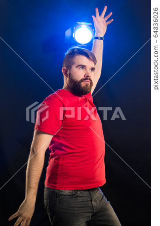 Young crazy man dancing. Joke and humor concept. 64836026