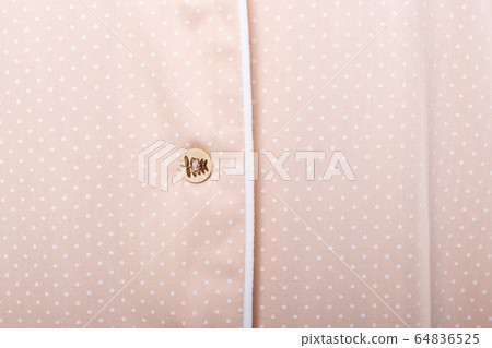 Close-up detail and fabric texture of a pajama. Homewear, sleepwear, shopping and sale concept. 64836525