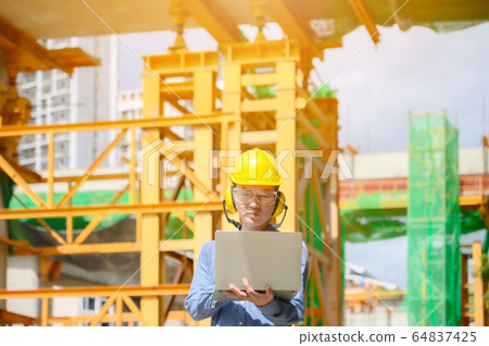 Young asian engineers are working on the construction site Young asian engineers are working on the construction site 64837425