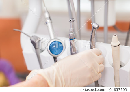 Dental tool equipment in stomatology clinic. Dentistry and dental health concept. Dental tool equipment in stomatology clinic. Dentistry and dental health concept. 64837503